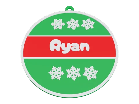 赤い帯に Ryan の名前と白い雪の結晶が入った緑のクリスマスボール